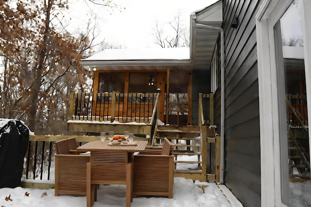 snow covered deck with grilling area