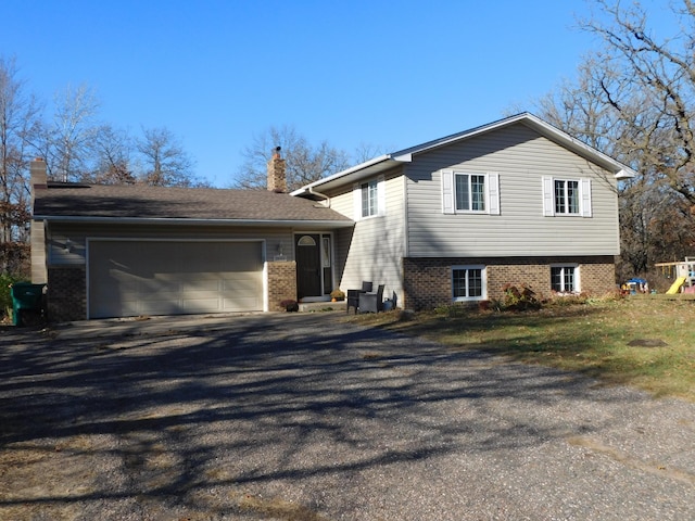 split level home with a garage