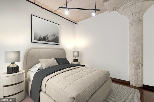 bedroom with dark wood-type flooring