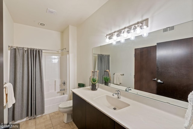 full bathroom featuring shower / tub combo with curtain, tile patterned floors, toilet, and vanity