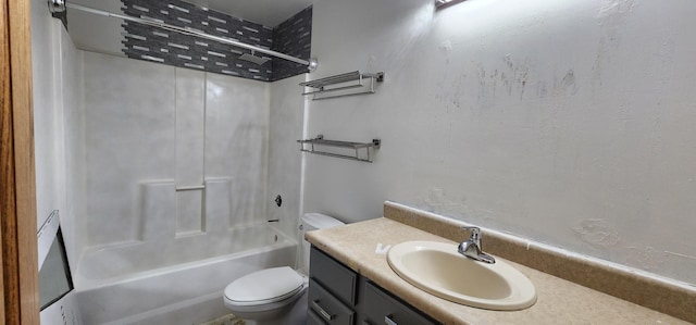 full bathroom featuring toilet, vanity, and bathing tub / shower combination