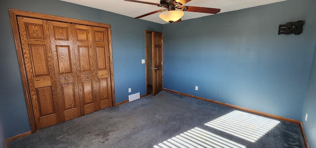 bedroom featuring dark colored carpet and ceiling fan