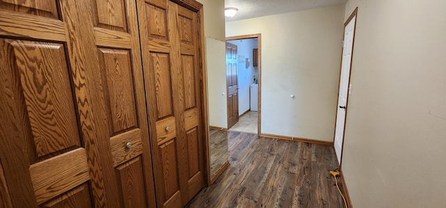 hallway with dark wood-type flooring