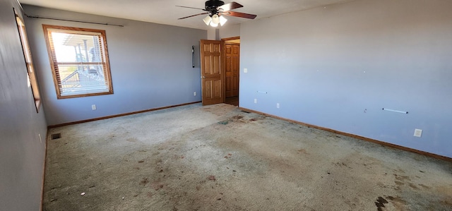 spare room with carpet flooring and ceiling fan