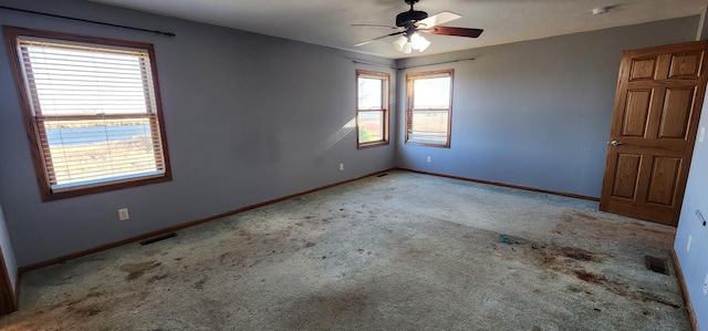 carpeted empty room with ceiling fan