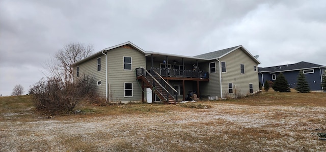 rear view of property with a deck