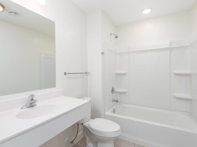 full bathroom featuring tile patterned floors, toilet, sink, and bathing tub / shower combination