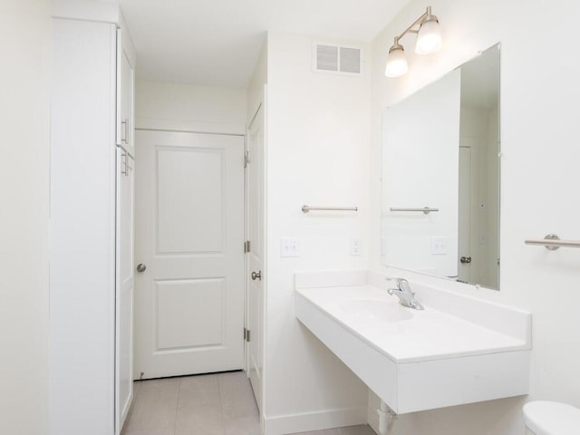 bathroom featuring tile patterned floors and sink