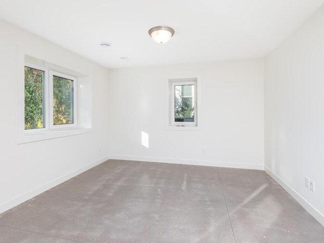 spare room featuring concrete floors