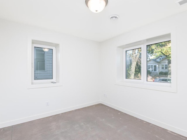 spare room with concrete flooring