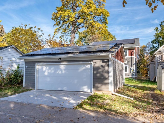 garage featuring solar panels