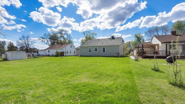 view of yard with a deck