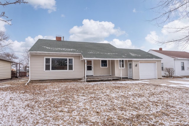 view of front of property with a garage and a porch