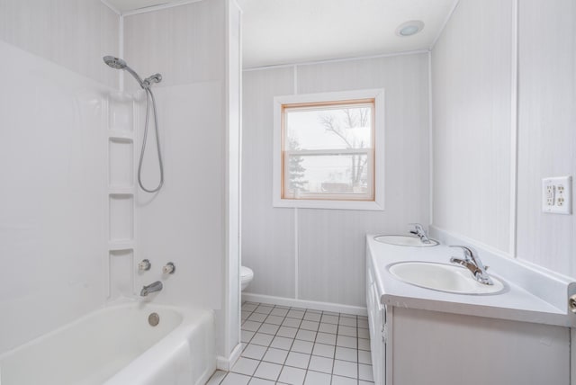 full bathroom featuring tile patterned flooring, vanity, toilet, and  shower combination