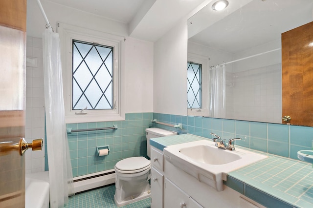 full bathroom with vanity, tile patterned floors, tile walls, shower / tub combo with curtain, and a baseboard radiator