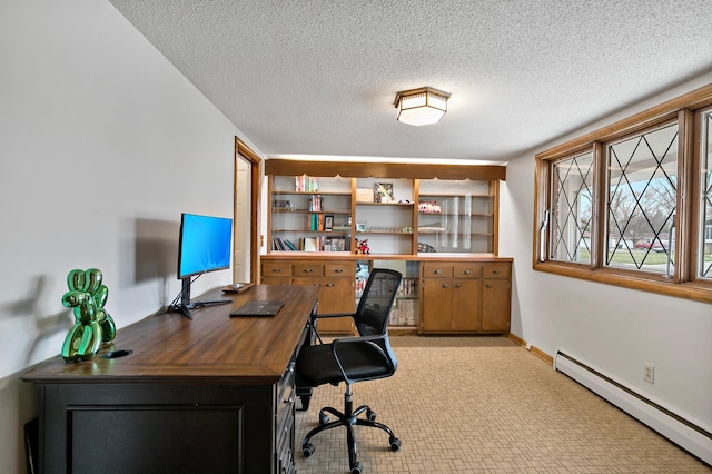 home office with a textured ceiling and baseboard heating