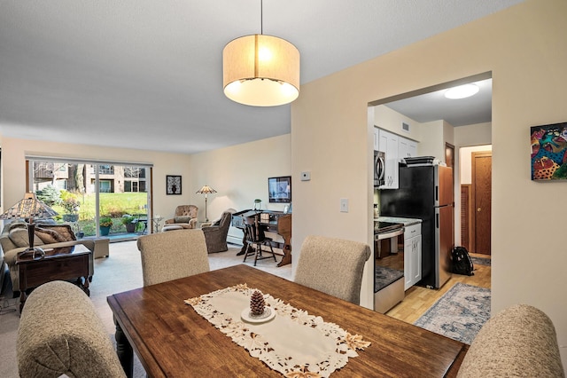 dining room with light hardwood / wood-style flooring