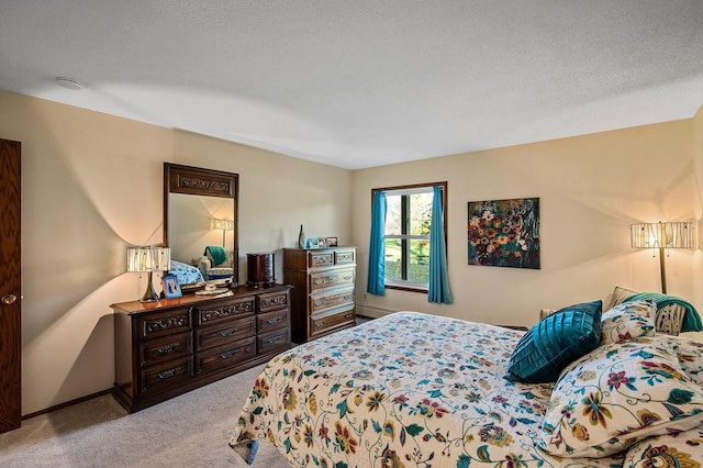 carpeted bedroom with a textured ceiling