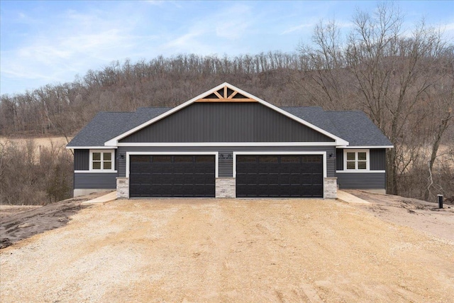S1546 Shawnee Dr Unit A, Alma, WI 54610 - view of front facade featuring driveway, a garage, and roof with shingles
