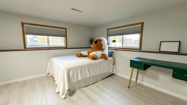 bedroom with light hardwood / wood-style flooring