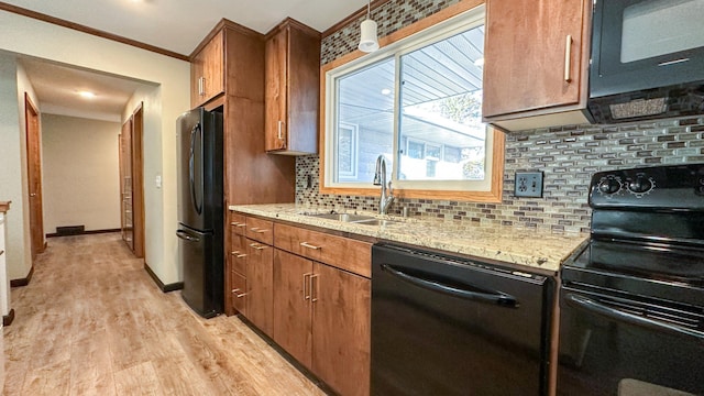 kitchen with backsplash, crown molding, sink, black appliances, and light hardwood / wood-style flooring