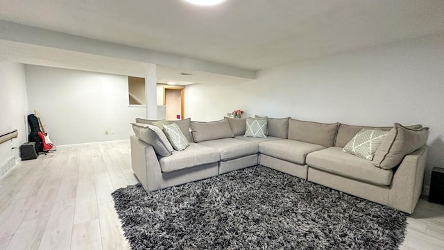 living room with light hardwood / wood-style flooring