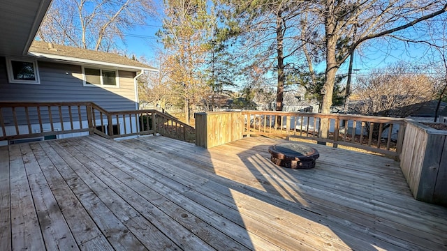 deck featuring a fire pit