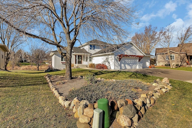 view of front facade with a front lawn and a garage