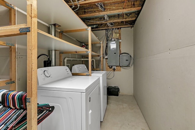 clothes washing area featuring washing machine and dryer and electric panel