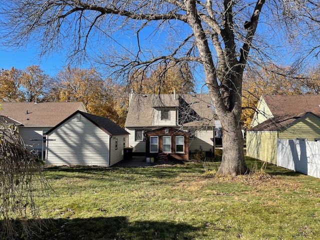 rear view of property with a patio area and a lawn