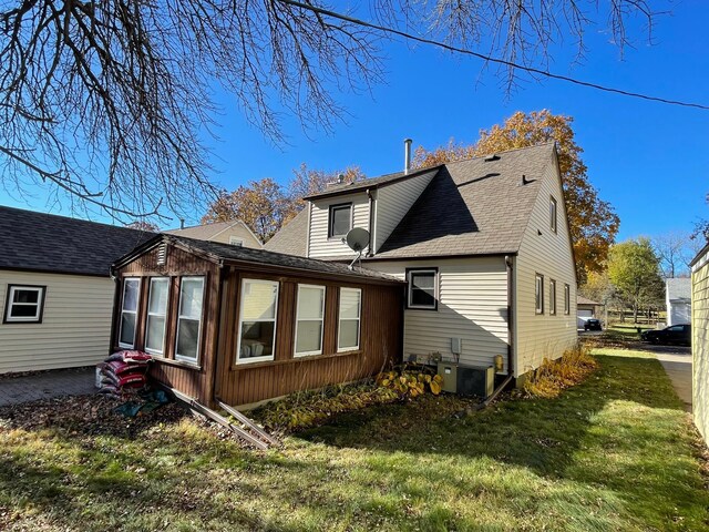 back of house with a yard