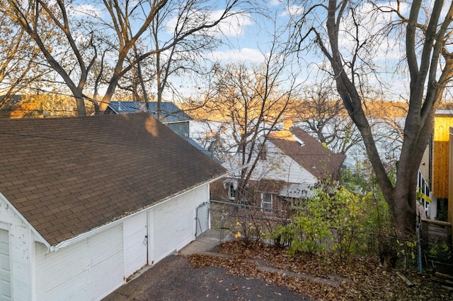 view of home's exterior with a water view