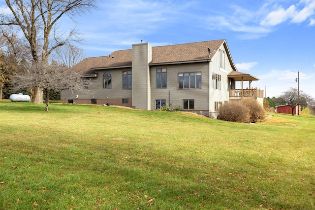 back of house with a yard