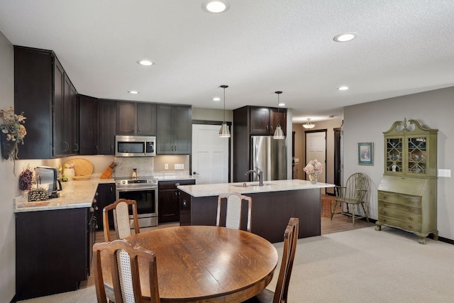 dining area with sink and light carpet