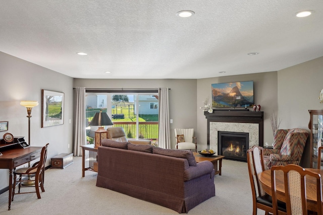 living room with light colored carpet and a textured ceiling