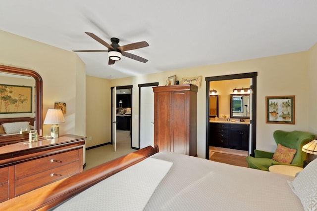 bedroom with connected bathroom and ceiling fan