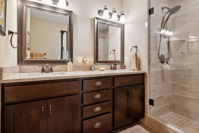 bathroom featuring vanity and a shower with shower door