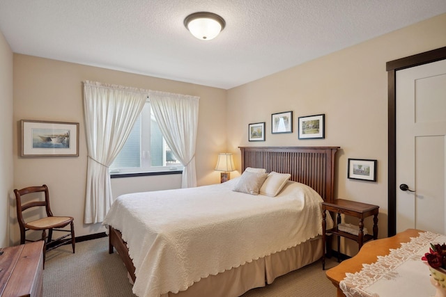 carpeted bedroom with a textured ceiling