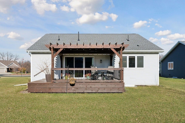 rear view of property featuring a deck, a pergola, and a yard