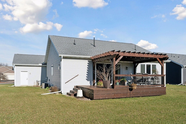 rear view of house with a pergola, a yard, cooling unit, and a deck