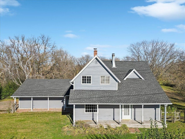 view of front facade featuring a front lawn and a patio area