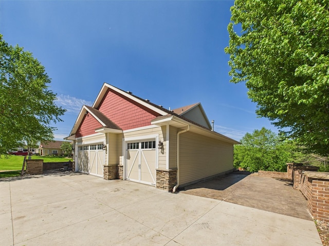 24850 Edenvale Trl, Elko New Market, MN 55020 - view of side of home with stone siding and driveway