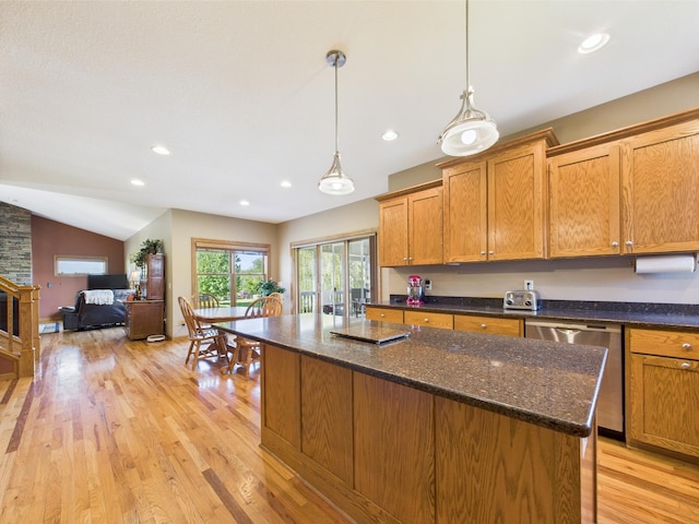 24850 Edenvale Trl, Elko New Market, MN 55020 - kitchen featuring stainless steel dishwasher, a center island, light wood finished floors, vaulted ceiling, and brown cabinets