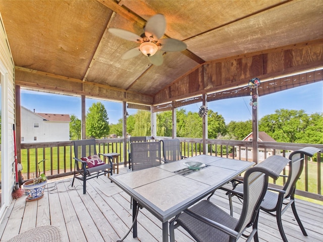 24850 Edenvale Trl, Elko New Market, MN 55020 - deck featuring a ceiling fan, outdoor dining space, and view of scattered trees