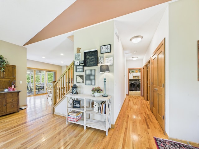 24850 Edenvale Trl, Elko New Market, MN 55020 - hall featuring washer and clothes dryer, light wood-style flooring, stairway, and vaulted ceiling