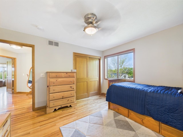 24850 Edenvale Trl, Elko New Market, MN 55020 - bedroom featuring light wood-style flooring, a closet, and ceiling fan