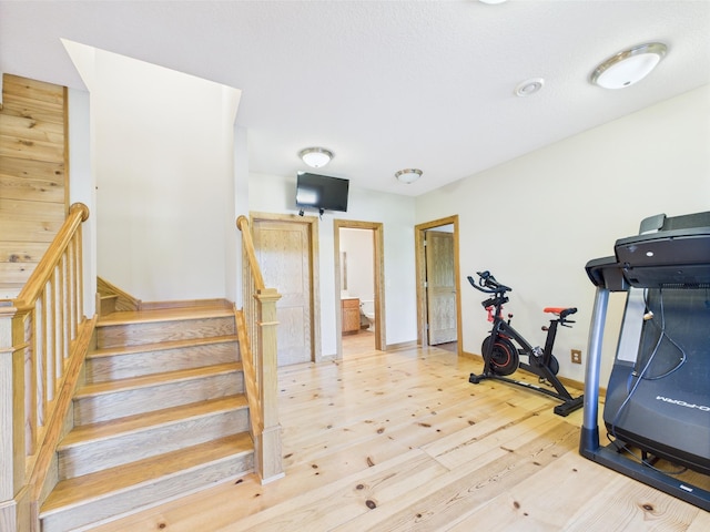 24850 Edenvale Trl, Elko New Market, MN 55020 - workout room with light wood-style flooring and baseboards