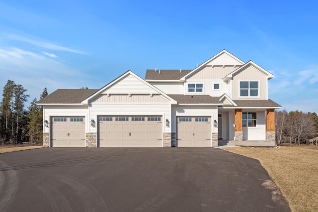 craftsman-style house featuring covered porch and a garage