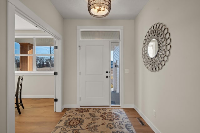 foyer entrance featuring light wood-type flooring