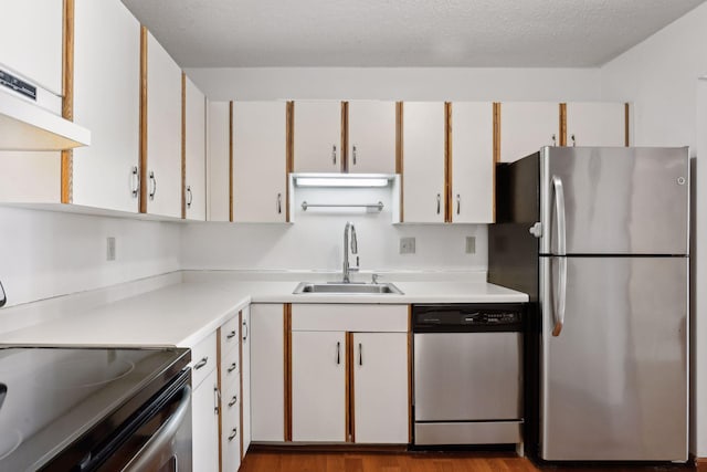 kitchen featuring white cabinets, sink, and stainless steel appliances